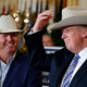 Trying on a Stetson hat.